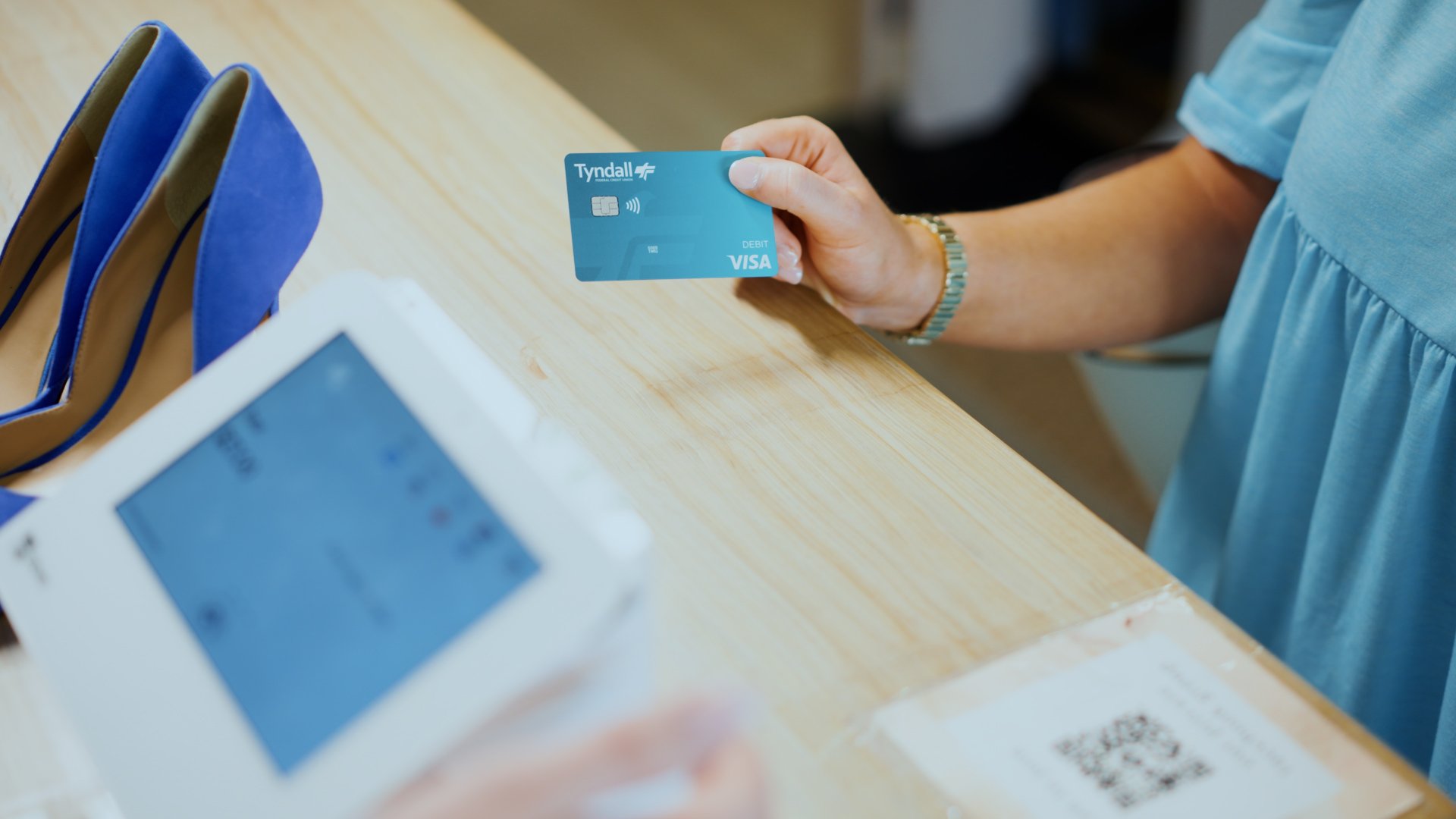 Person making a debit card purchase