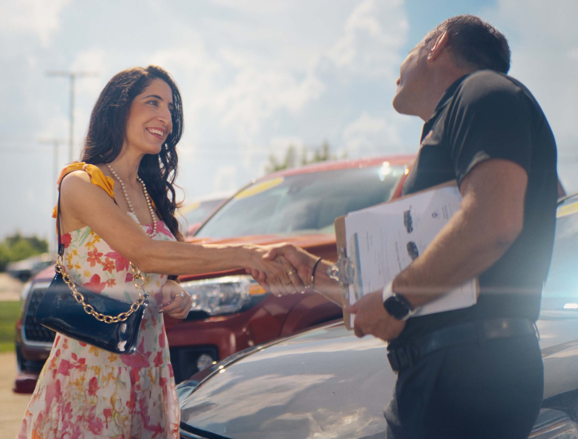 Woman at car dealership