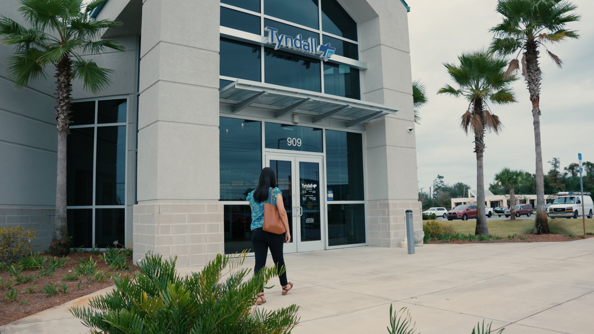 Image of person walking into branch