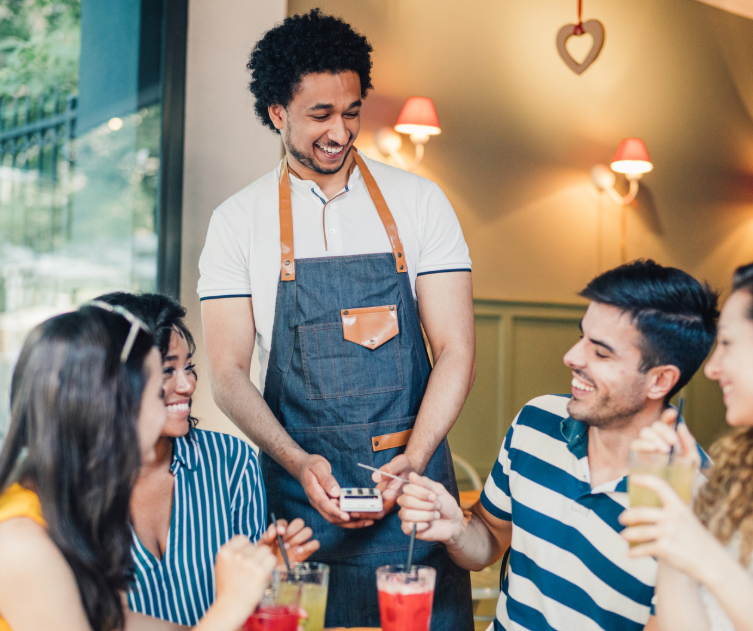Friends paying for lunch